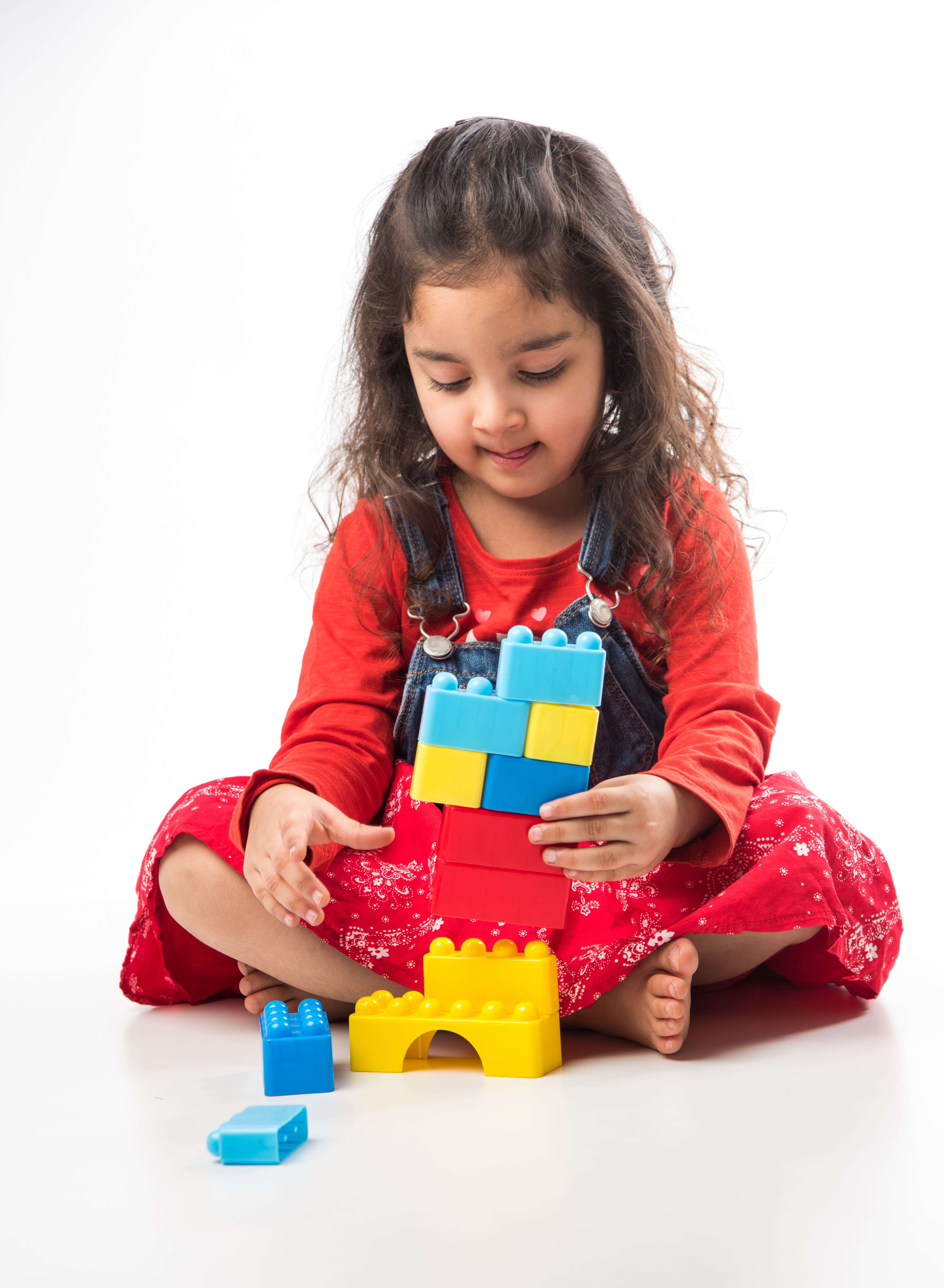 Child building with blocks at Cocomelos Kids Play Zone